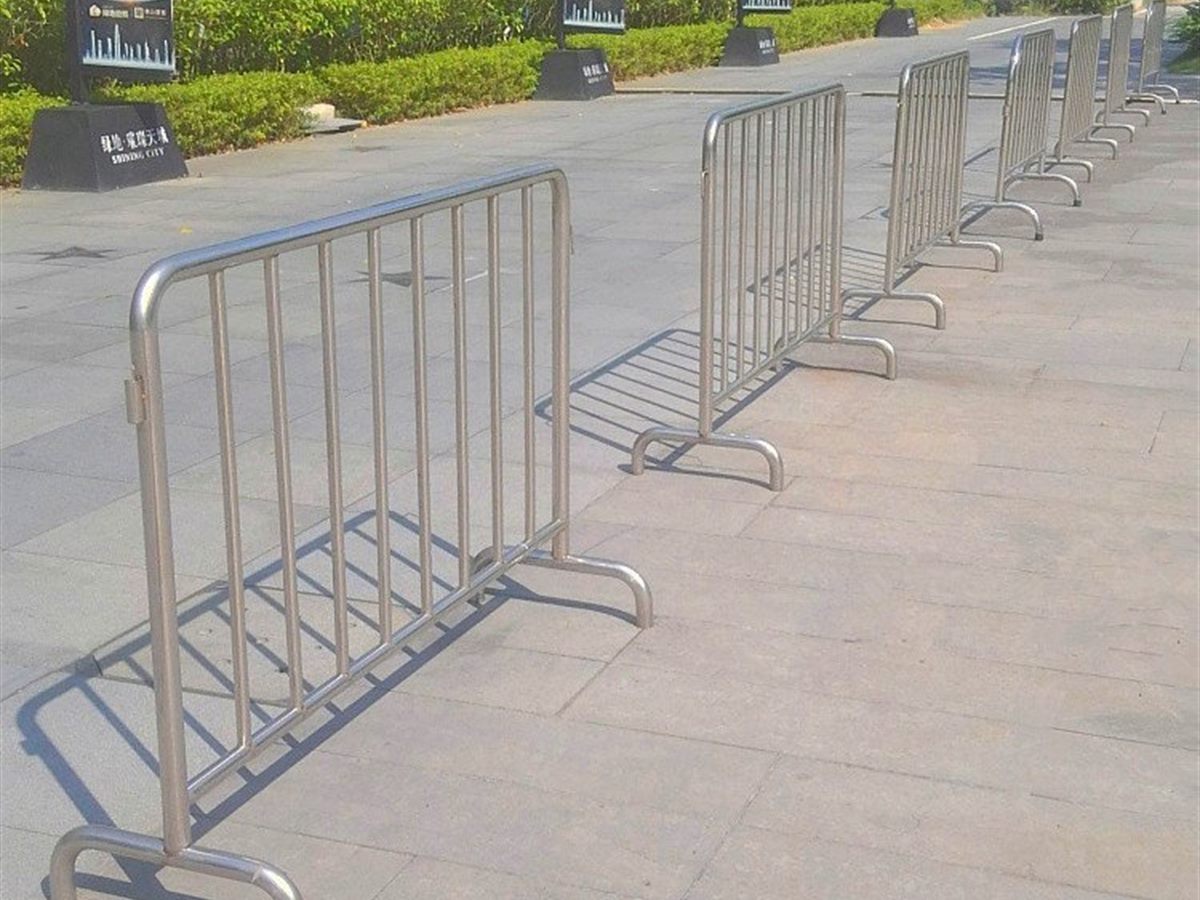 Crowd-Control Barrier — Interlocking steel barrier panel with vertical bars in a continuous run