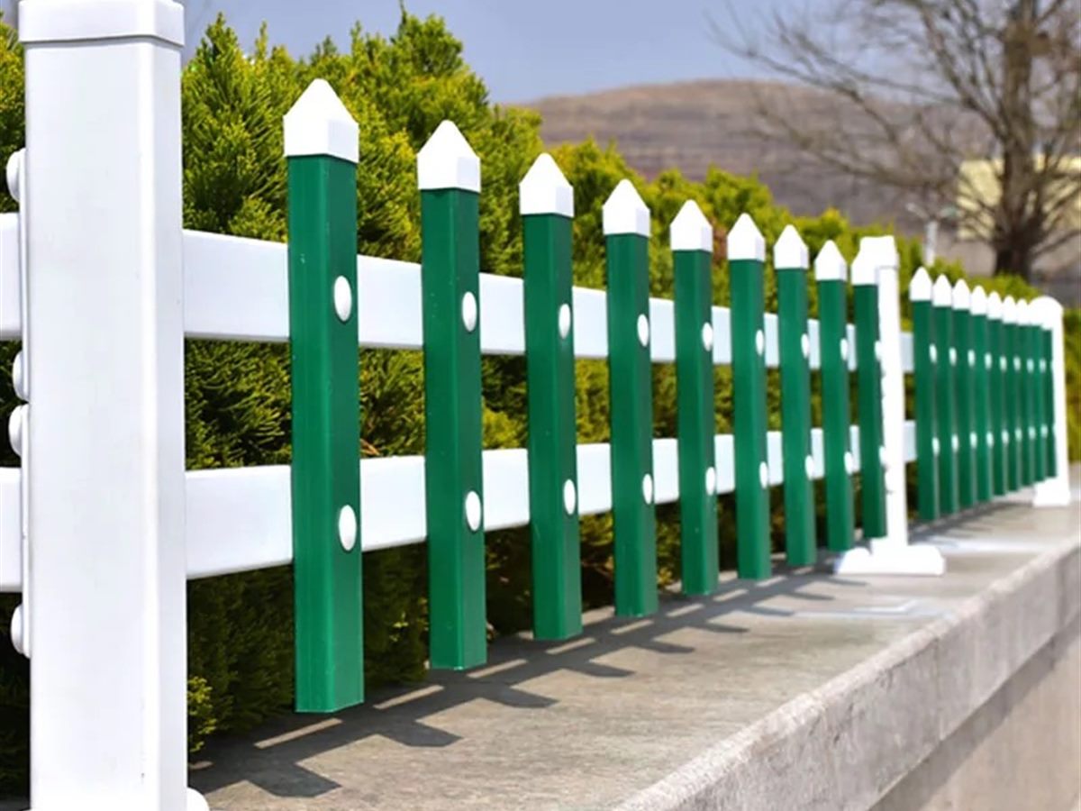 Low railing set along a lawn edge in a green belt (thumbnail 2)