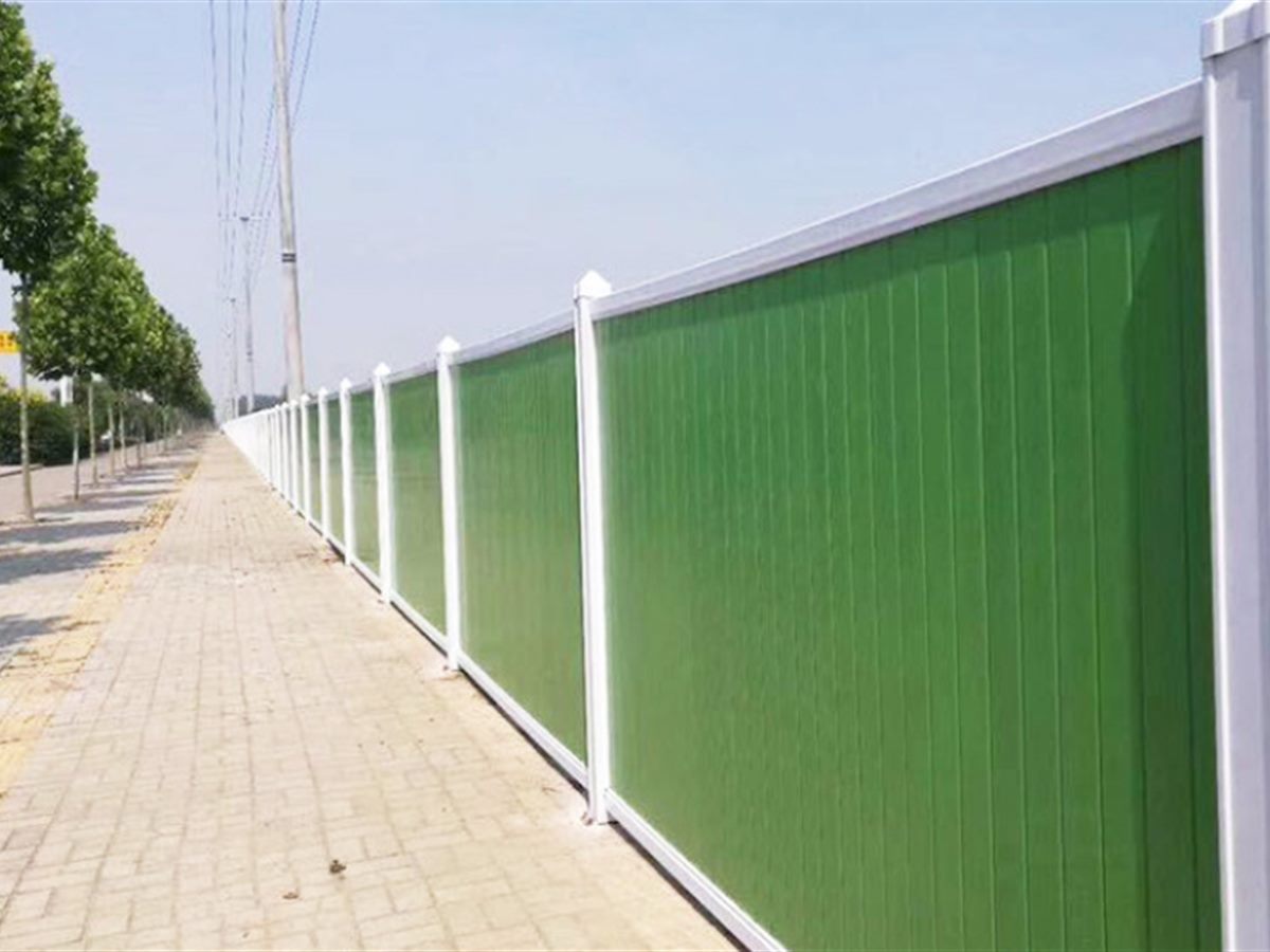 PVC hoarding panel held in a galvanised slot with a square-tube brace behind (thumbnail 3)