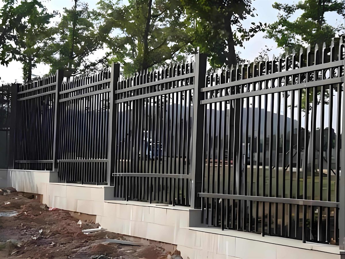 Zinc-Steel Perimeter Railing — Zinc-steel perimeter railing section with vertical bars between coated posts